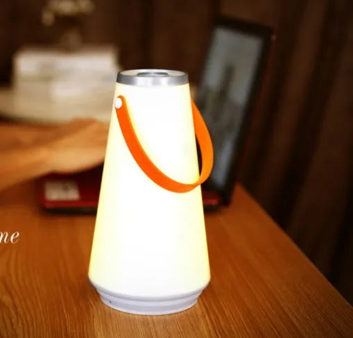 White rechargeable LED bedside lamp with USB charging cable showing dimensions 12x12x22cm