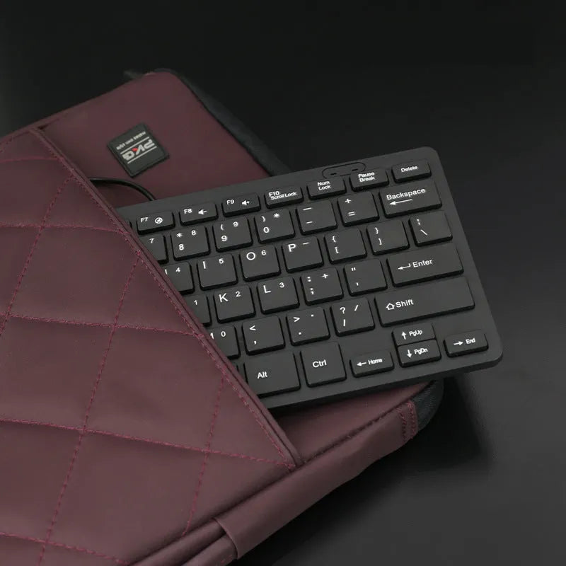 Compact USB wired keyboard measuring 280x125mm in black colour with noiseless keys