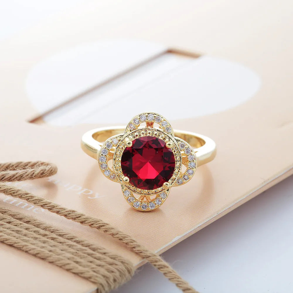 Copper ring with dark blue electroplated finish featuring zircon stones in fruit-shaped pattern