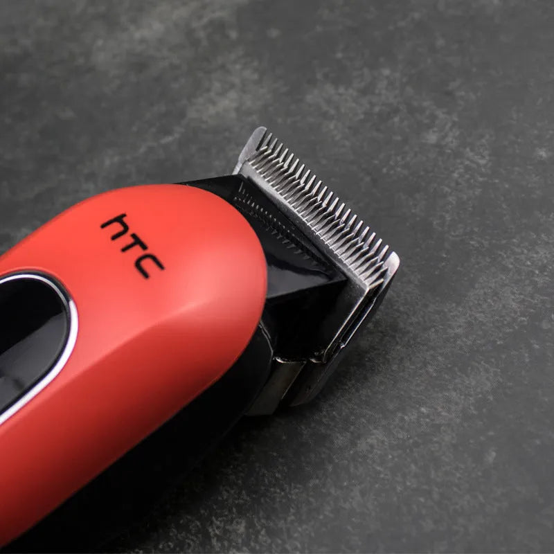 Professional digital hair clipper in black, red, or white with brushless motor, charger, and 4 limiting combs.