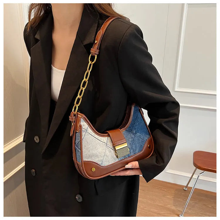 Brown denim women's bucket shoulder bag with chain strap and diamond mesh detail.
