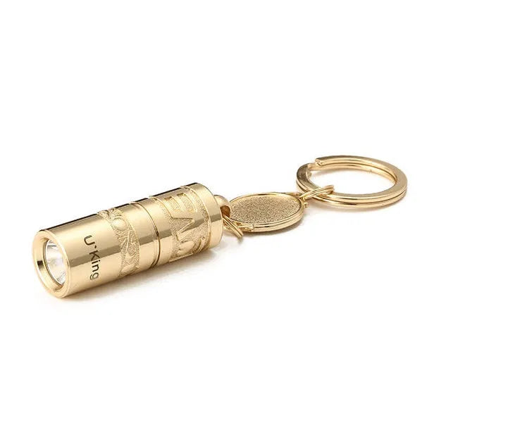 Gold-coloured waterproof zinc alloy portable LED flashlight on a keychain ring.