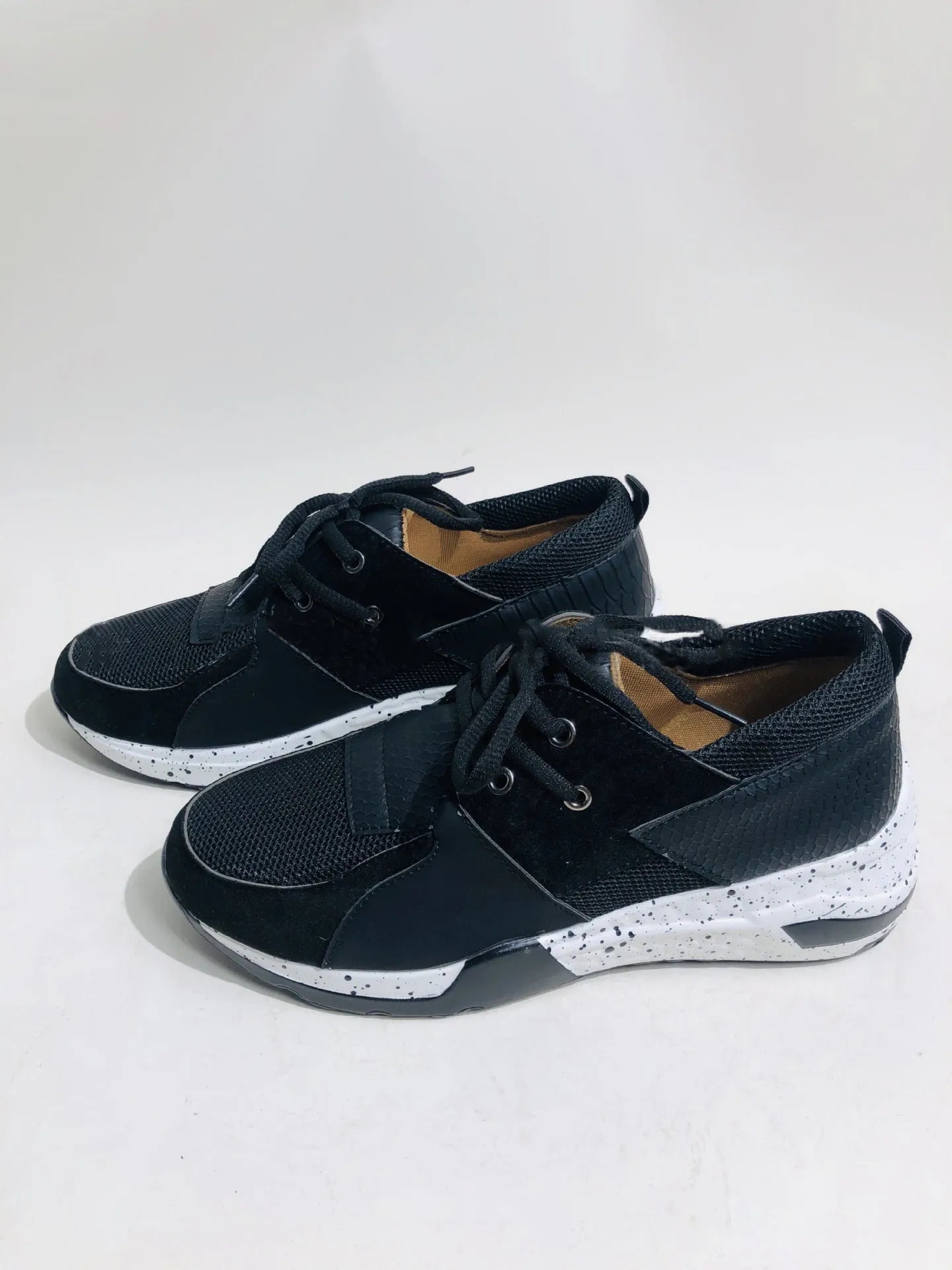 Women's casual suede sneakers with wedge heel in various colours and patterns.
