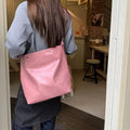 Corduroy commuter shoulder bag in pink colour with one-shoulder carry design