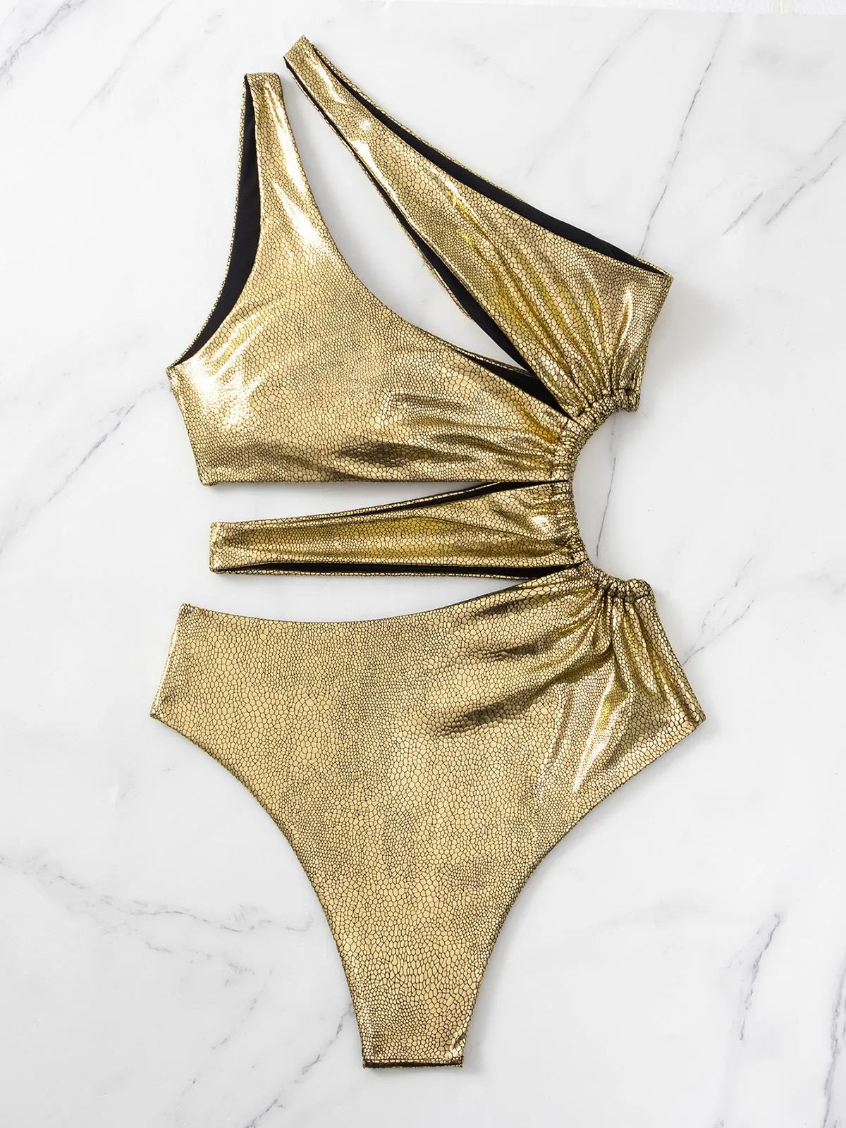 Women's solid gold one-piece swimsuit with backless, sleeveless design on a mannequin
