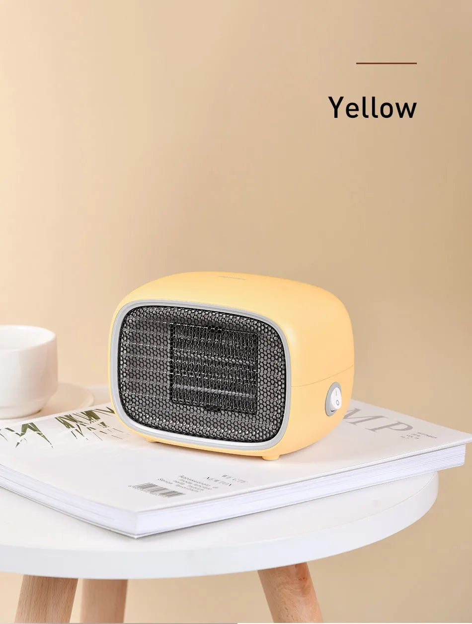 Compact green portable heater with metal grille showing dimensions 158mm x 90mm x 114mm.