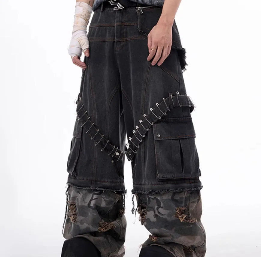 Men's grey camouflage jeans with structural splicing and pin/ribbon details on cotton denim fabric