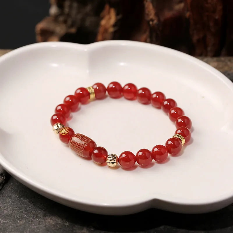 Adjustable unisex Guanyin agate bracelet with auspicious patterns, shown in green and red stone options.