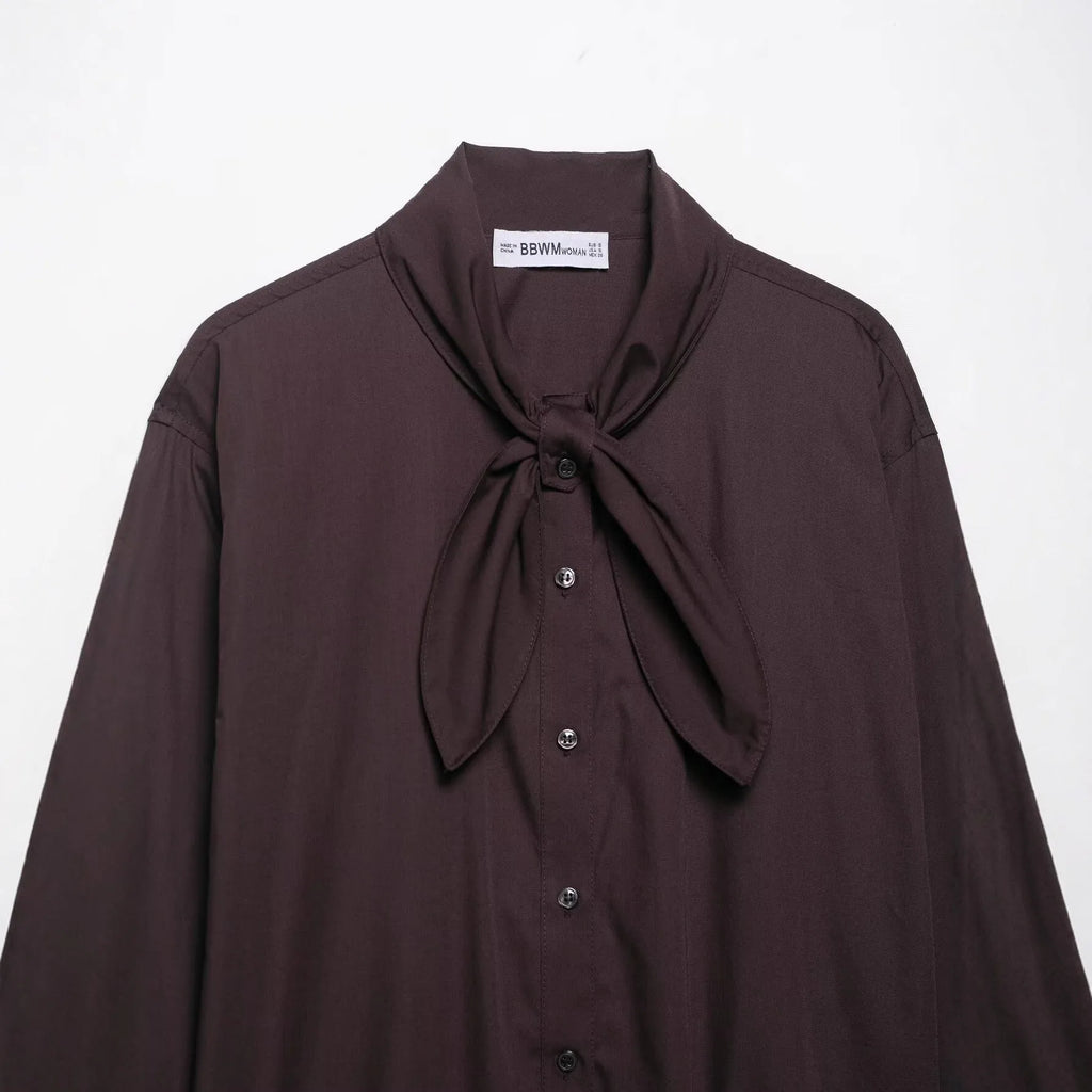 Brown women's shirt with long sleeves and bow tie collar in polyester poplin fabric