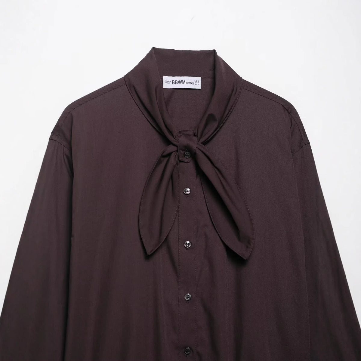 Brown women's shirt with long sleeves and bow tie collar in polyester poplin fabric