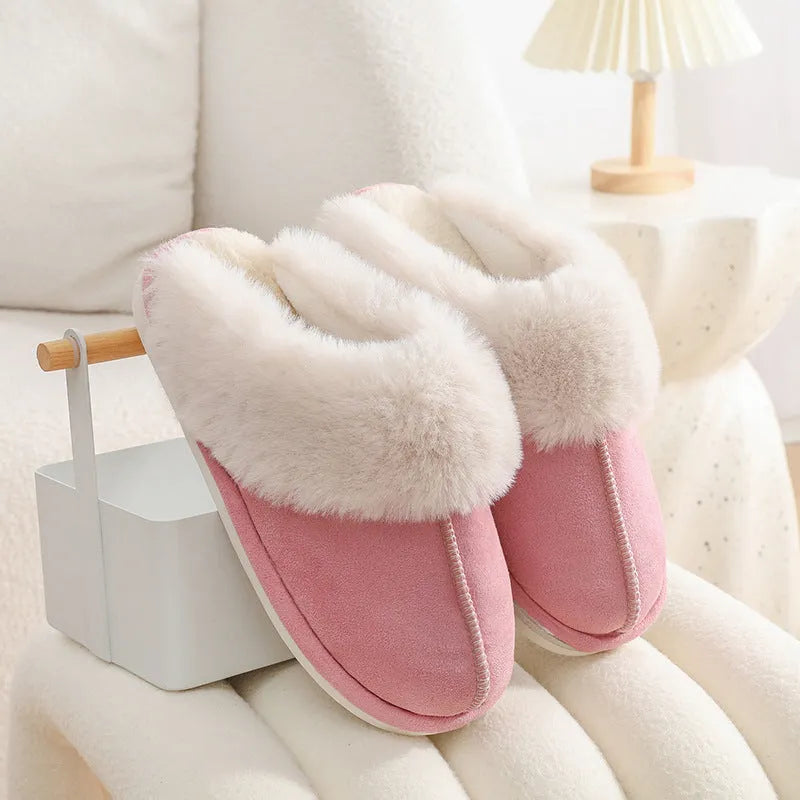 Women's plush-lined indoor slippers with round toe and flat heel in a choice of colours.