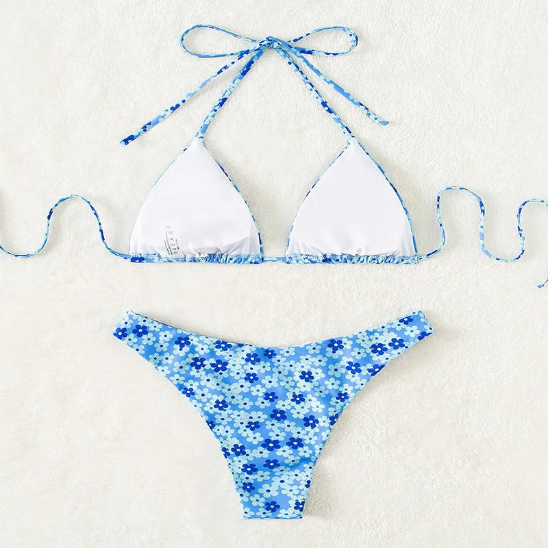 Women's blue floral swimsuit set with lace-up front and high-leg shorts