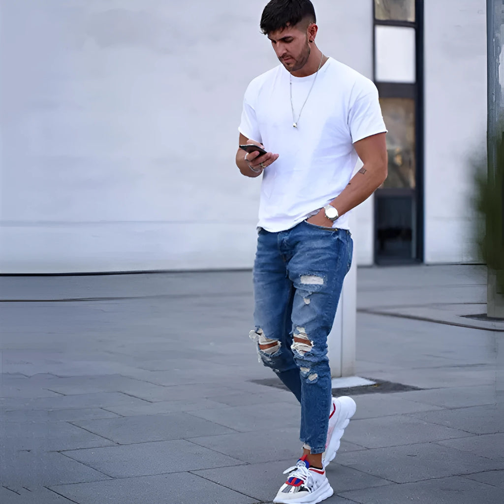 Deep blue men's straight leg jeans with 98% cotton composition on Asian size chart