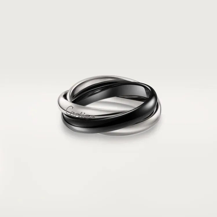 Geometric U-shaped sterling silver couple's ring in gold rose silver with full diamond setting on a size guide.
