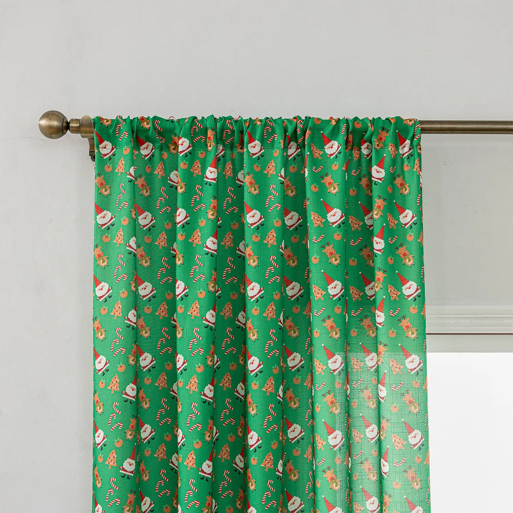Green Christmas curtain with printed cartoon snowman and angel figures