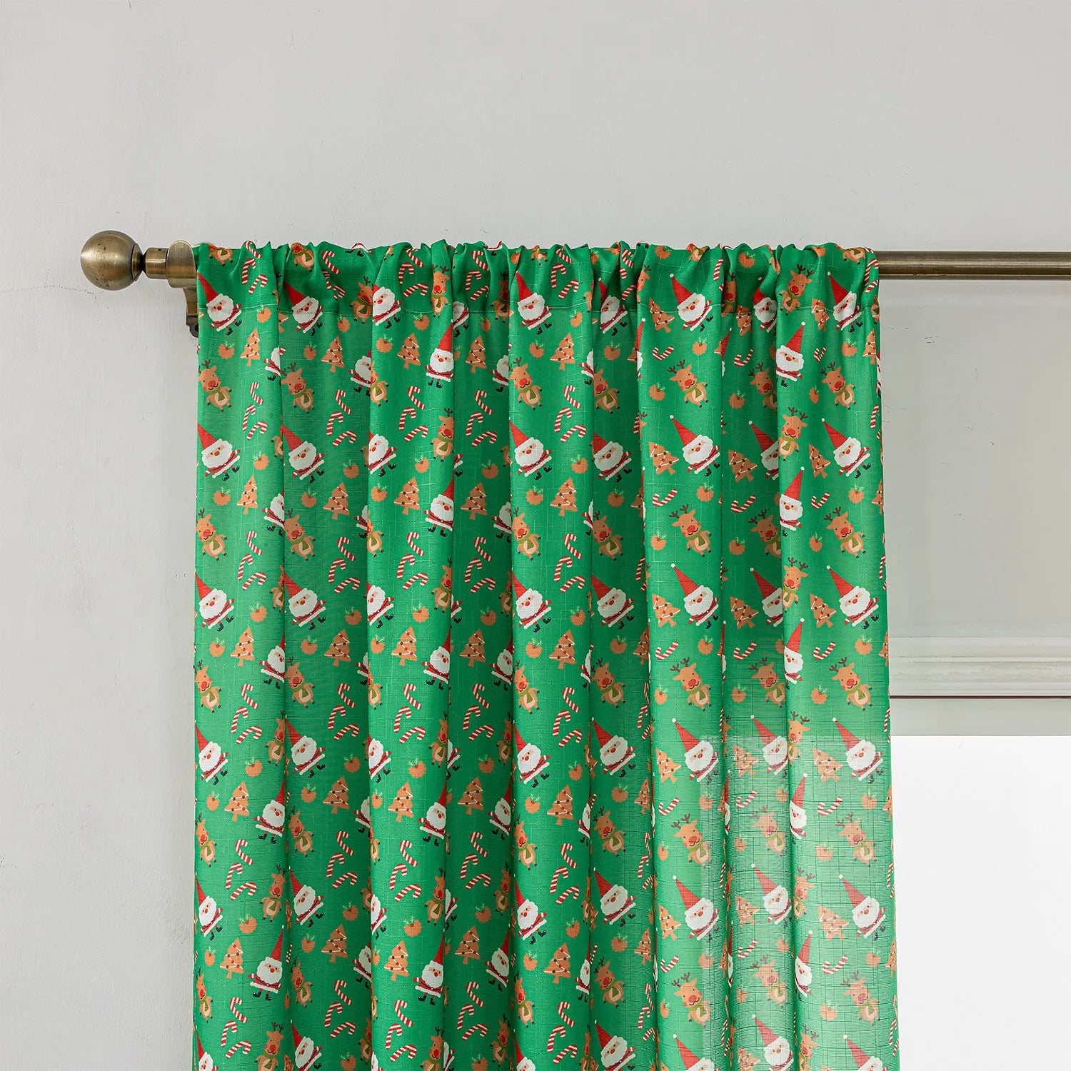 Green Christmas curtain with printed cartoon snowman and angel figures