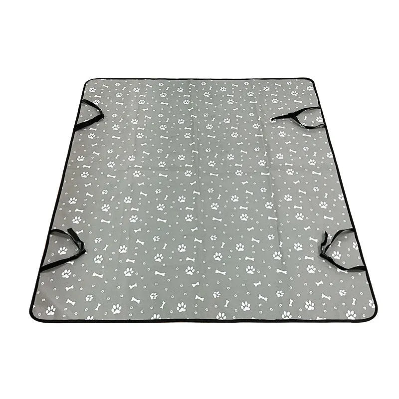 Grey cloth car pet mat with dog footprint print covering a car rear seat.
