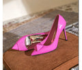 Pink patent leather women's stiletto high heels with pointed toe and metal rivet buckle detail.