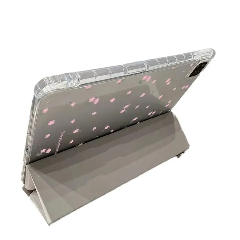 Transparent floral tri-fold iPad protective case with built-in stand, shown closed with magnetic clasp.
