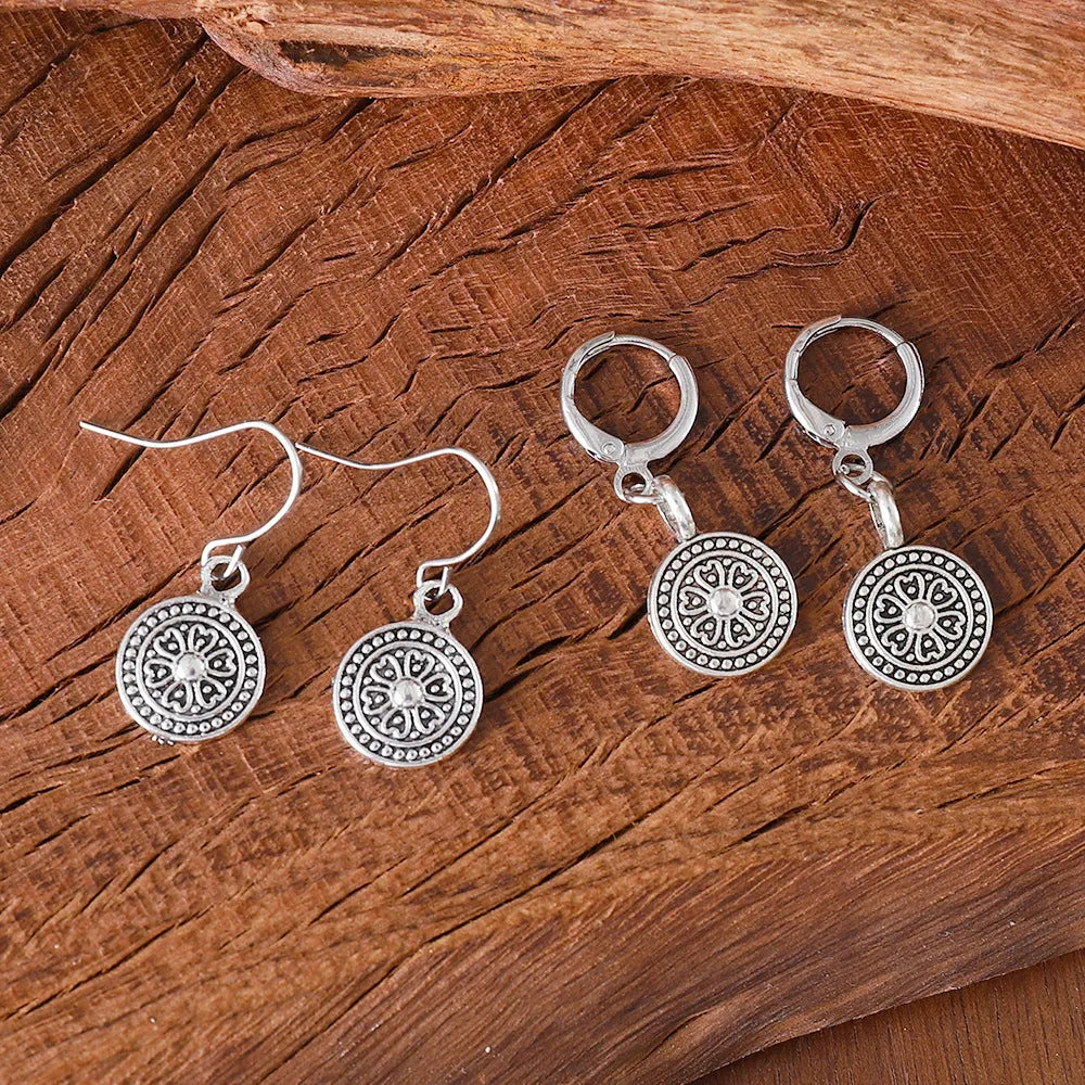 Round geometric earrings with distressed ethnic print in electroplated zinc alloy