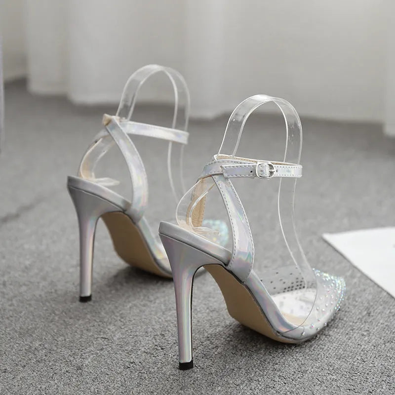 Women's pointed toe sandals with stiletto heel and diamond detail, made from PVC, shown on a size chart.