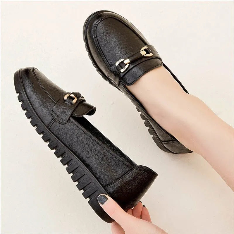 Black casual pumps with soft rubber sole and microfibre upper, shown on a plain background.