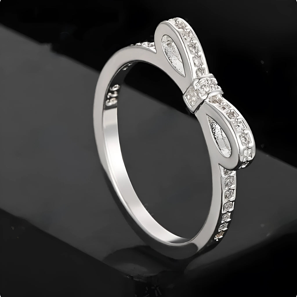 Silver bow-shaped ring with crystal zircon rhinestones in couple style design