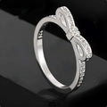 Silver bow-shaped ring with crystal zircon rhinestones in couple style design