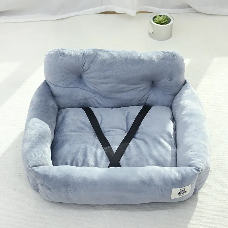 Car-mounted pet travel nest in stain-resistant cloth fabric showing grey and blue plaid options