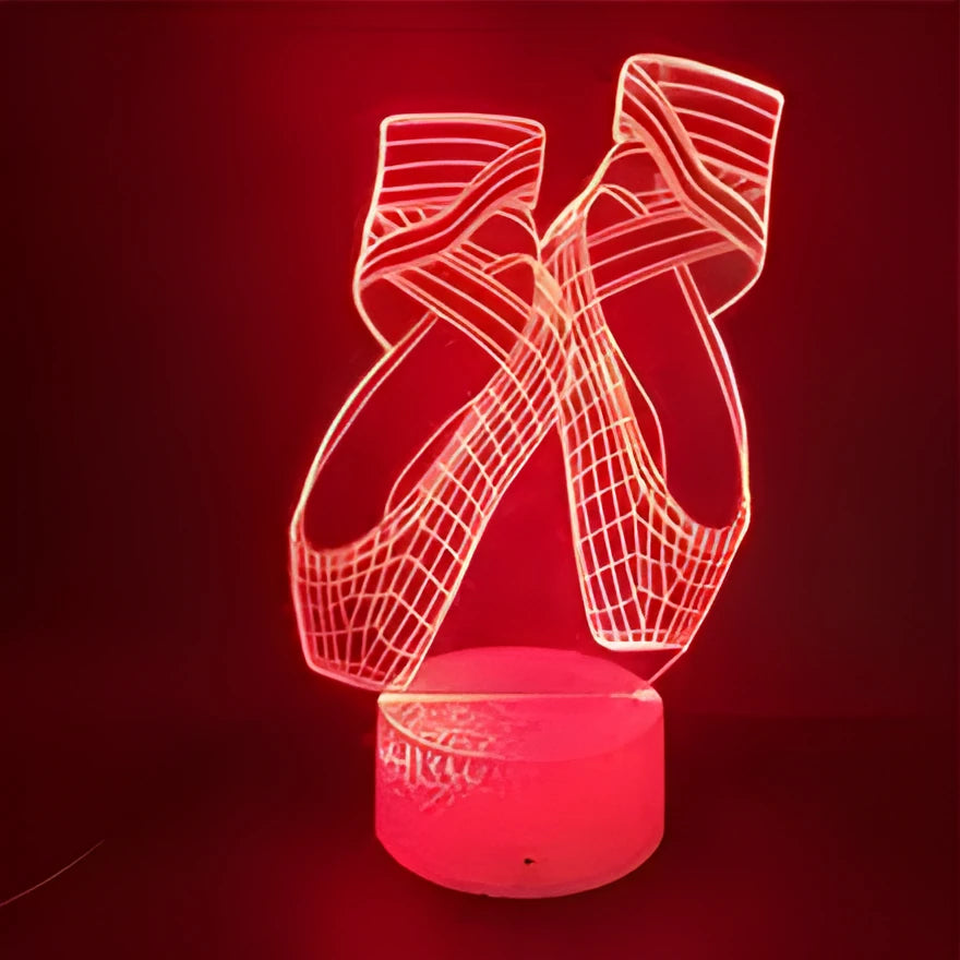 3D ballet shoes night light with colourful LED glow, showing remote control and USB cable.