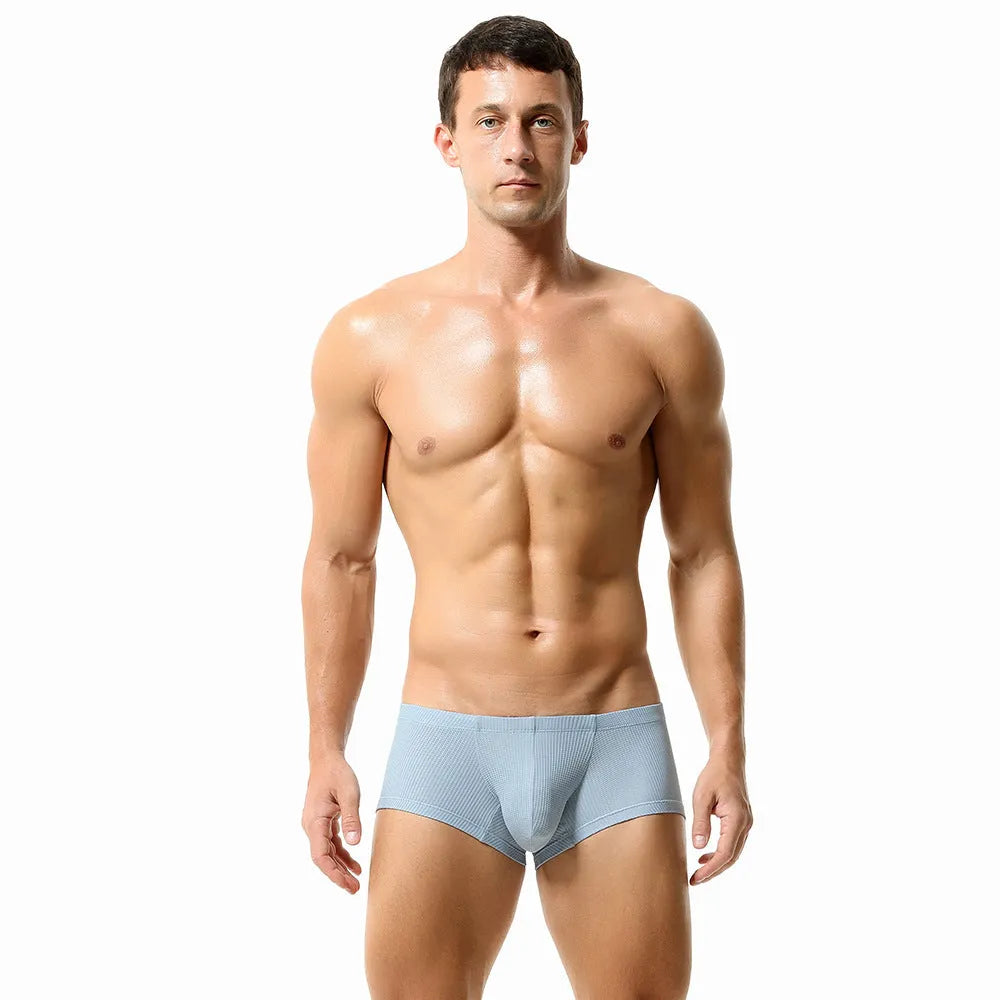 Men's solid colour nylon boxers with mid-low waist design in orange red, cloud blue, green, light blue, or beige