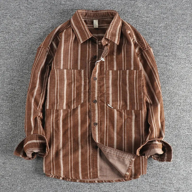 Man wearing a vintage-inspired apricot and brown striped casual shirt with a loose, Japanese retro fit.