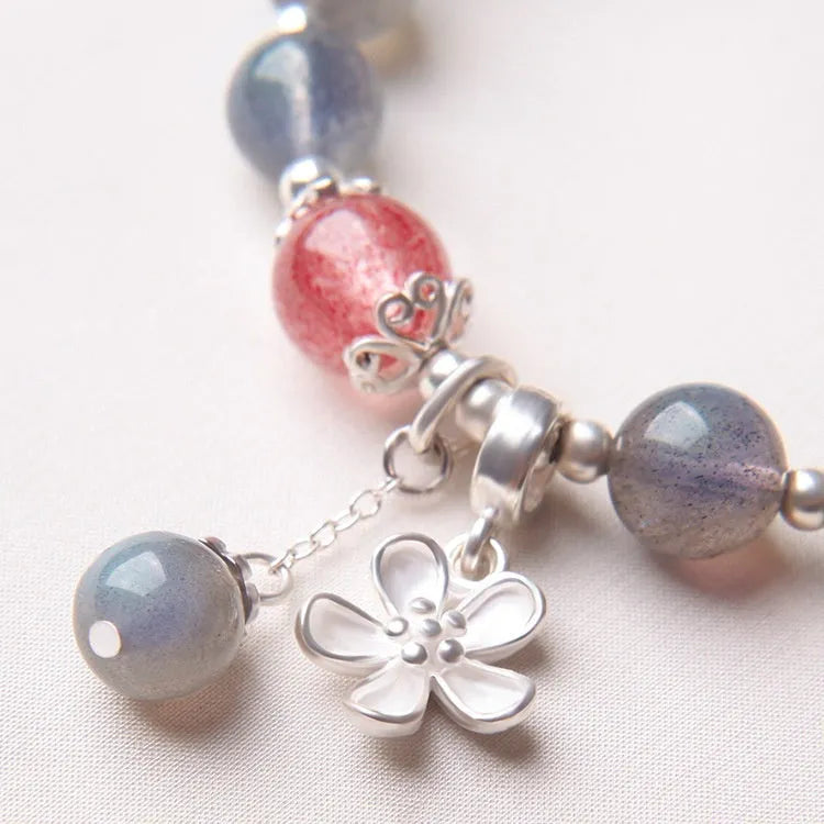 Women's crystal bracelet with 7.5mm beads and silver honeysuckle charm