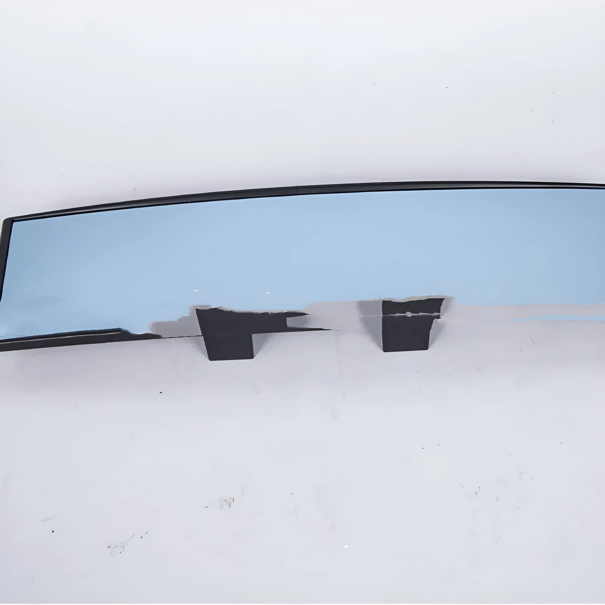 Curved blue anti-glare wide-angle car rearview mirror with snap-on fitting, shown from the front.