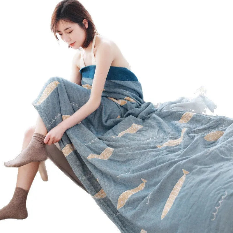 Blue five-layer gauze cotton bed sheet blanket folded, showing modern simplicity pattern and thickness.