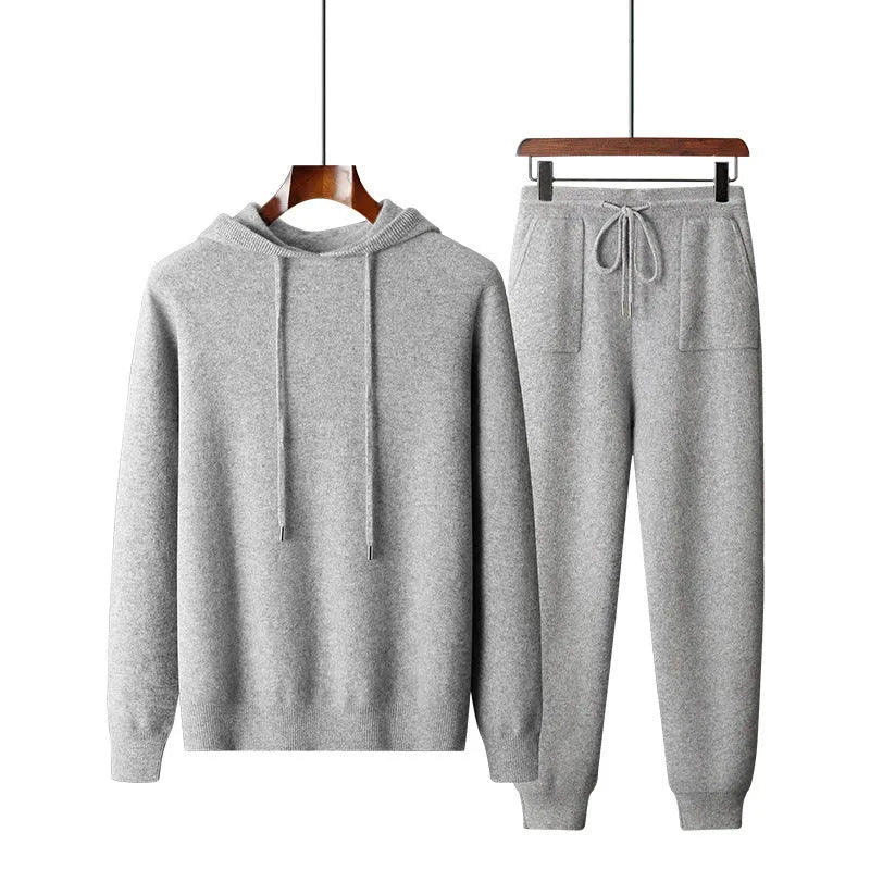 Men's light grey cashmere hooded sweatshirt and matching long pants laid flat.