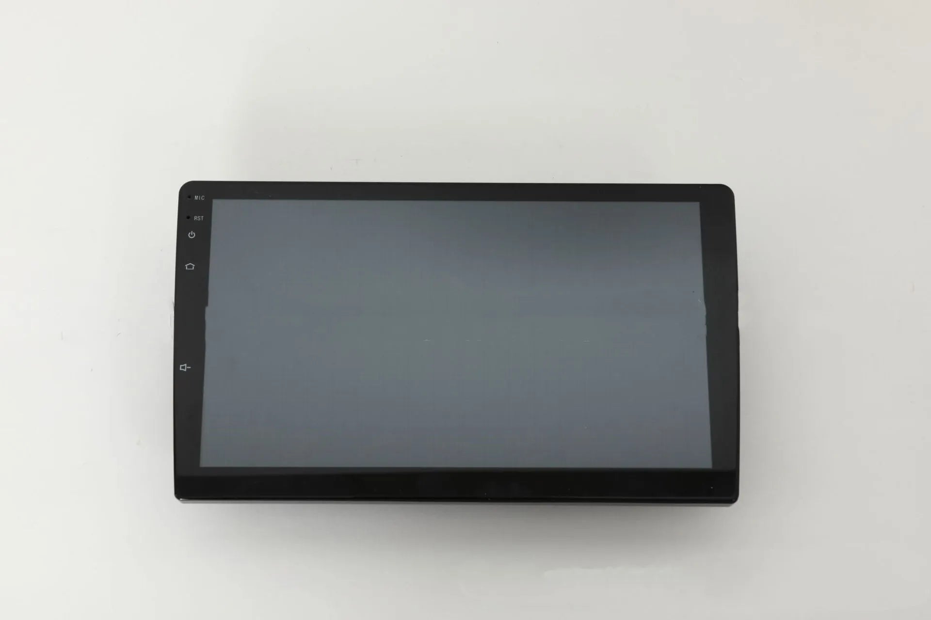 10.1 inch universal Android car stereo with trapezoidal touchscreen display and GPS antenna