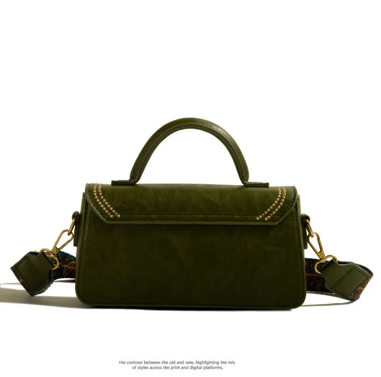 Brown retro messenger bag with square vertical shape showing contrast stitching and shoulder strap