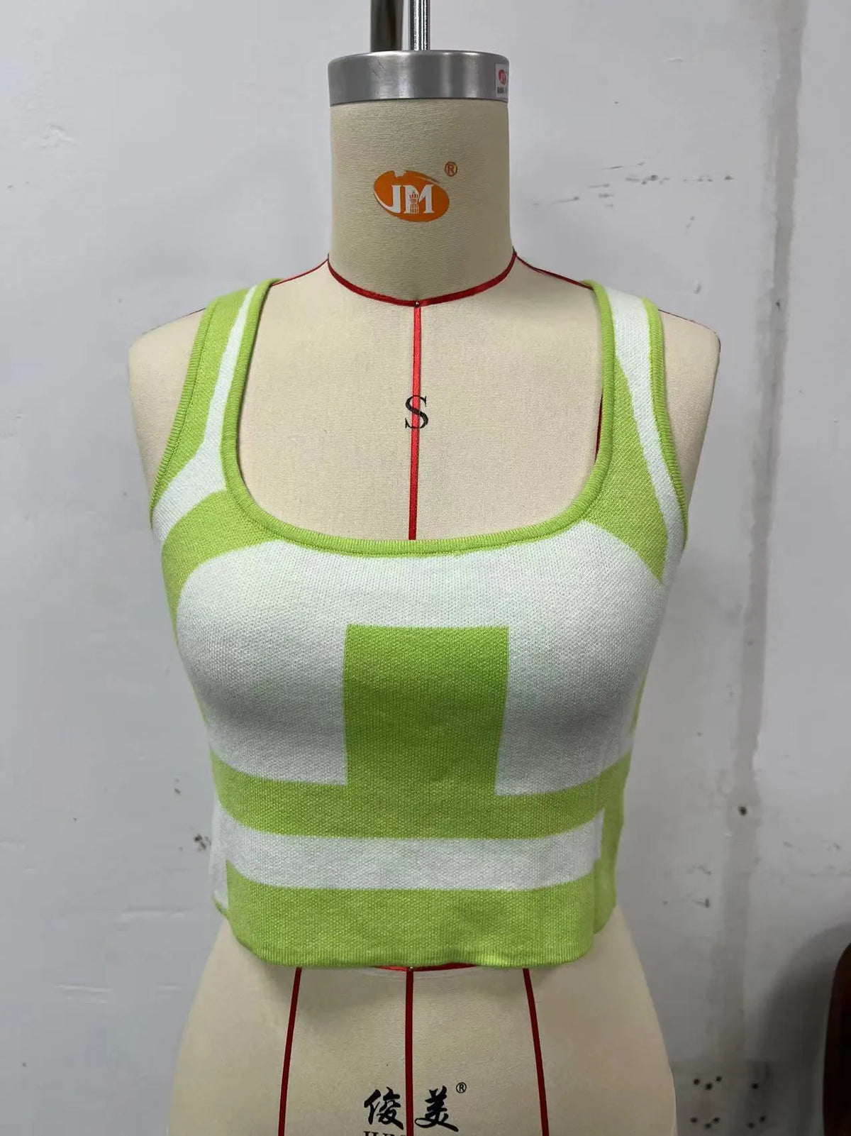 Women's U-collar camisole top in core-spun polyester fabric, shown in slim fit with exposed navel style.
