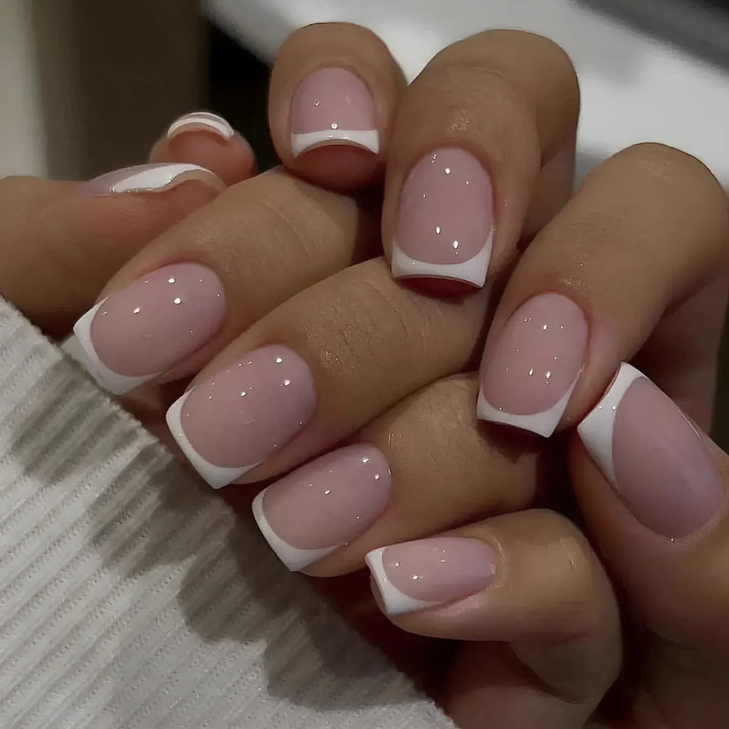 24 white fake nails with a black and grey plaid pattern, laid out as press-on nail tips.