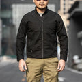 Men's brown tactical camouflage jacket with multiple pockets on a mannequin.