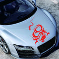 Black dragon design car body sticker measuring 50 by 36 centimetres on a vehicle front end.