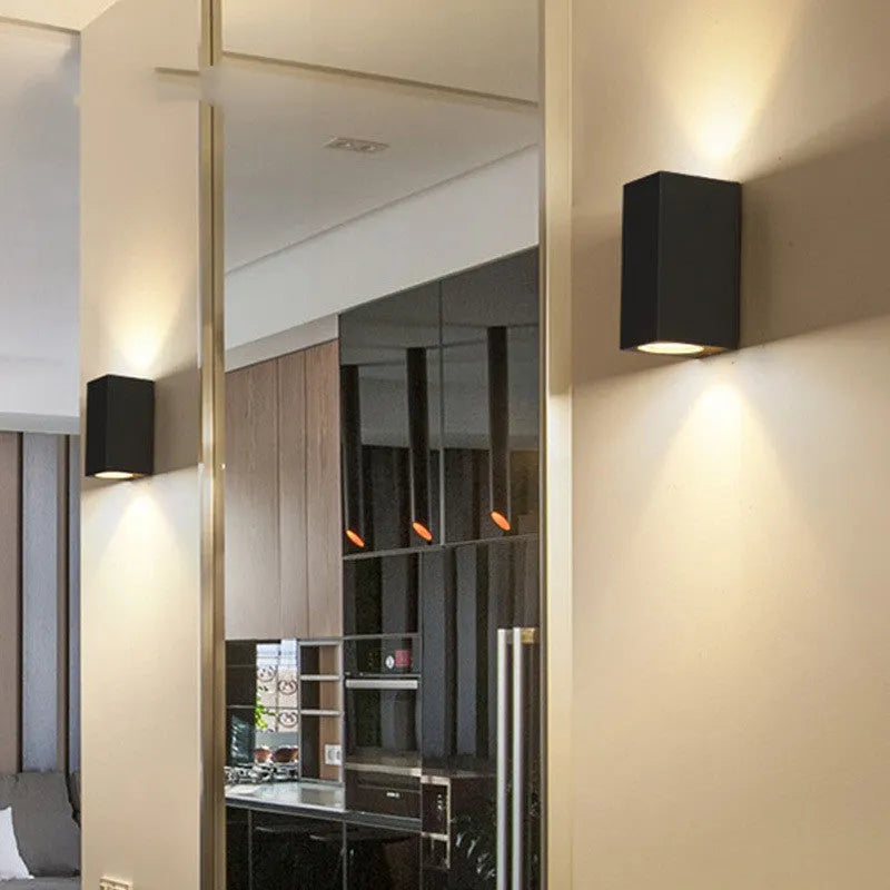 Black aluminium wall lamp with silicone rubber trim and glass elements