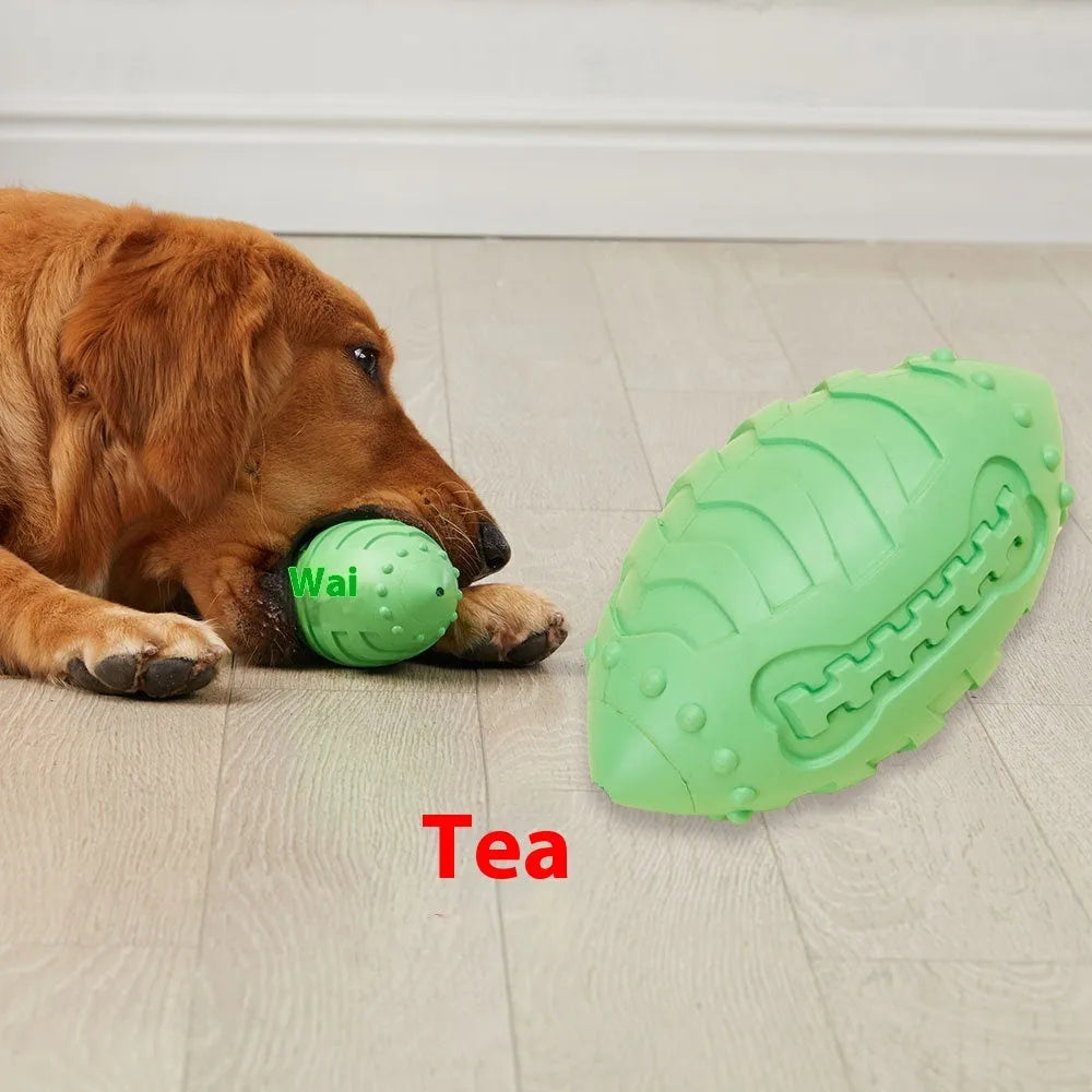Light green thickened rubber rugby ball dog toy with squeaker for bite-resistant interactive training and teeth cleaning.