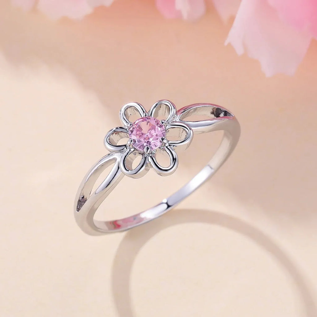 Women's flower hollow fashion ring in copper with electroplated metallic finish