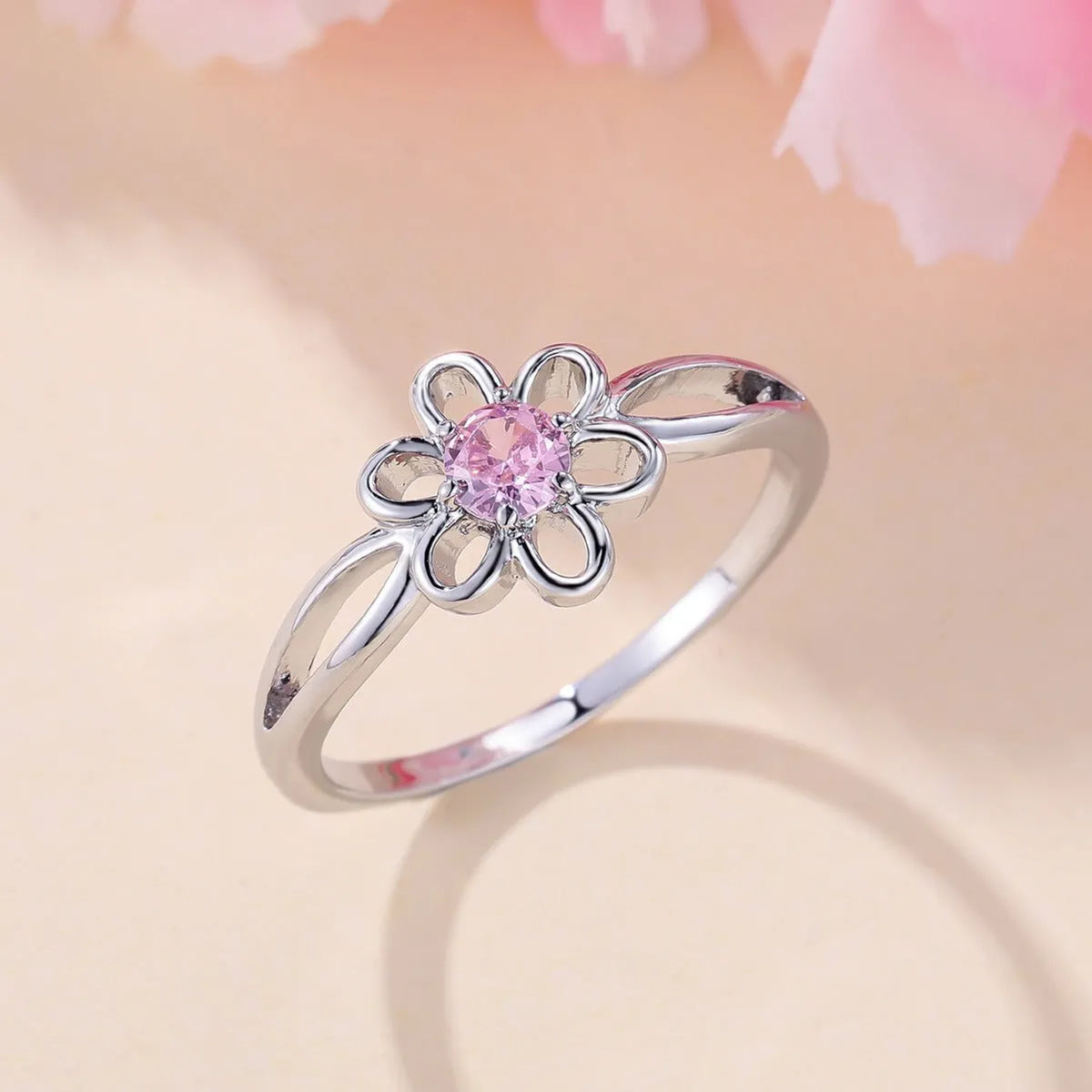 Women's flower hollow fashion ring in copper with electroplated metallic finish
