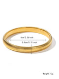 Women's gold titanium steel elastic bracelet with vertical stripe ring pattern, shown at an angle.