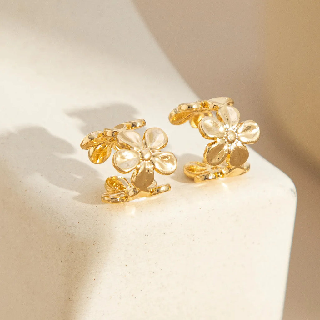 Gold women's earrings with starfish and scallop beach designs on alloy construction