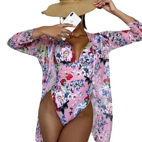 Women's floral print bikini three-piece swimsuit set in green, shown with a matching coat.