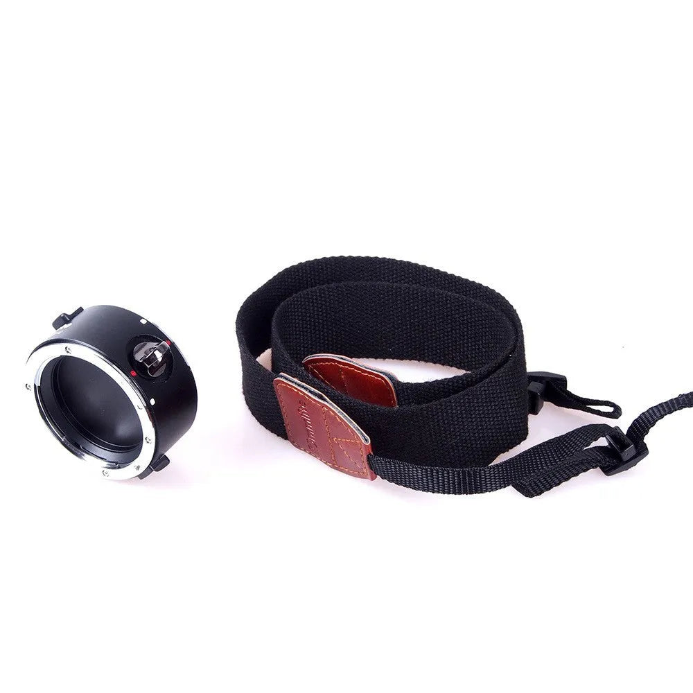 Aluminium camera lens flipper holder for Nikon F-mount with cotton shoulder strap.